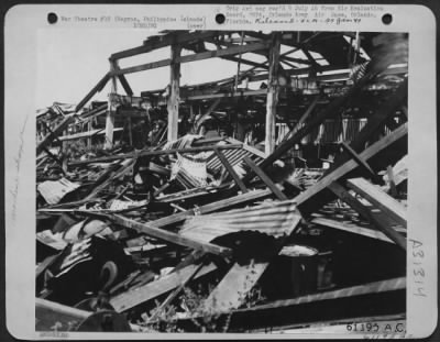 Thumbnail for Consolidated > The machine shop of the Lopez Sugar Central at Fabrica, Negros Island, Philippine Islands, was demolished by our air raid. The Japs were distilling alcohol here for fuel. 25 May 1945.