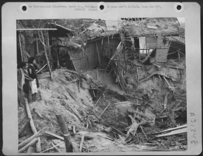 Thumbnail for Consolidated > Homes of thousands of Filipinos were demolished when Japanese artillery and air raids rained down destruction on them. Houses above are of bamboo construction and were easy targets for the enemy, as is seen by this 13th AAF photo. Tocloban, Leyte