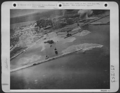 Thumbnail for Consolidated > Fifth Air Force "Sun Setters" loose bombs over Zamboange Harbor, Mindanao Island, in the Philippines, to prevent the port's being used as an embarkation point to reinforce Leyte. 28 October 1944.