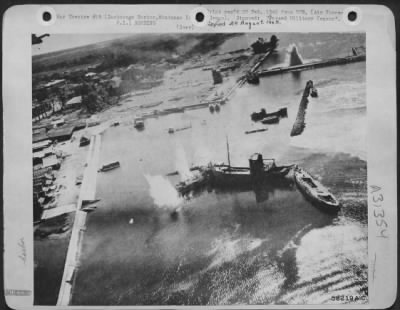 Thumbnail for Consolidated > While bombs were still bursting the 5th AF "Sun Setters" come in low on a strafing run at Zamboanga, Mindanao, in the Philippines. Zamboanga was one of the Jap-held ports pounded to prevent their being used for sending troops or supplies to Leyte.