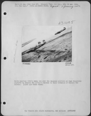 Consolidated > North American B-25's sweep low over the Japanese airfield at Cape Gloucester captured by General MacArthur's Marines in their invasion of western New Britain. (FIFTH AIR FORCE PHOTO)