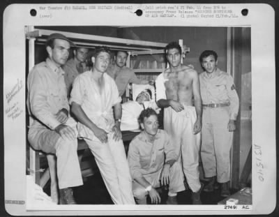 Thumbnail for Consolidated > Eight wounded survivors of the 10 man crew of a B-24 Liberator bomber of the U.S. Army 13th Air Force, which returned safely to its base after an air battle over Rabaul, New Britain Island. Three Jap Zeros were definitely shot down and 5 others