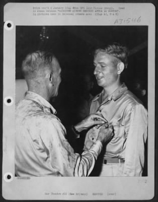 Thumbnail for Consolidated > Lt. Marvin C. Hughes receives the Purple Heart from Brig. Gen. Ennis C. Whitehead. Lt. Hughes, Baird, Texas, a navigator, was one of the American flyers who was rescued from under Japanese noses on New Britain Island after having been marooned in the