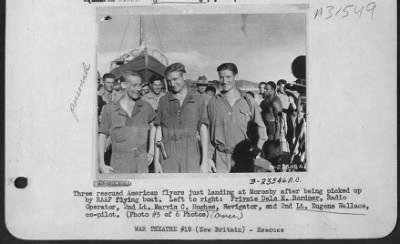 Thumbnail for Consolidated > Three rescued American flyers just landing at Moresby after being picked up by RAAF flying boat. Left to right: Private Dale E. Bordner, Radio Operator, 2nd Lt. Marvin C. Hughes, Navigator, and 2nd Lt. Eugene Wallace, co-pilot.