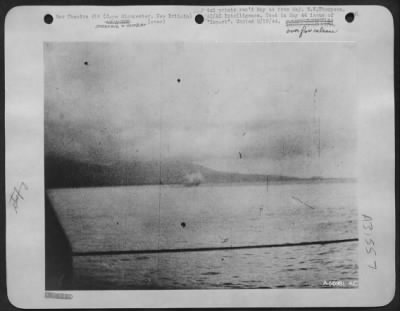 Thumbnail for Consolidated > North American B-25 is just hitting water, as a result of LST gunfire on 26 Dec 43 off Cape Gloucester, New Britain.