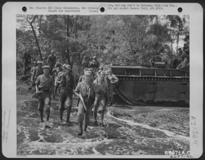 Thumbnail for Consolidated > United States Marines of the 1st Marine division enter the ramp of an LCM through the surf of Borgan Bay while on a patrol which took them some 2000 yards back of the lines in what was then still Japanese held territory. Patrol party was transported