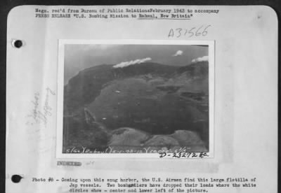 Thumbnail for Consolidated > Coming upon this snug harbor, the U.S. Airmen find this large flotilla of Jap vessels. Two bombardiers have dropped their loads where the white circles show-center and lower left of the picture.