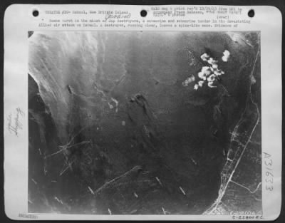 Thumbnail for Consolidated > Bombs burst in the midst of Jap destroyers, a submarine and submarine tender in the devastating Allied air attack on Rabaul. A destroyer, running clear, leaves a spine-like wake. Evidence of how completely the Japs were taken by surprise is seen in