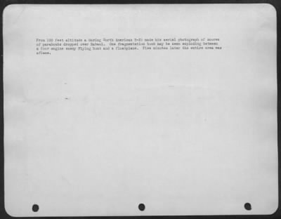 Thumbnail for Consolidated > From 100 feet altitude a daring North American B-25 made his aerial photograph of scores of paraboms dropped over Rabaul. One fragmentation bomb may be seen exploding between a four engine enemy Flying boat and a floatplane. Five minutes later