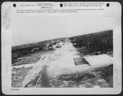 Consolidated > Jap planes burning at Tobera Airfield, Rabaul, after an attack by North American B-25's in which 36 enemy planes were destroyed on the ground at Rabaul's airfields.