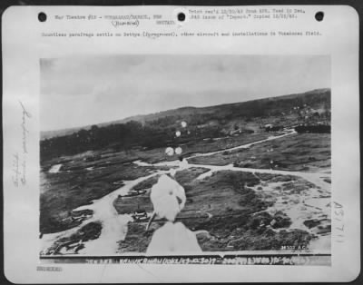 Thumbnail for Consolidated > Countless parafrags settle on Bettys (foreground), other aircraft and installations in Vunakanau field.