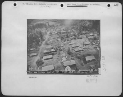 Thumbnail for Consolidated > Gen Rabaul 2 Nov - 43. [A Bomb Run On A Japanese Base; Perhaps Vunakanau In Rabaul. Parachute Bombs Can Be Seen Falling.]