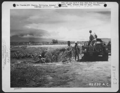 Thumbnail for Consolidated > In order to prevent Malaria, Filipinos, under the direction of 37th Malaria Control Unit, spray oil on a small stream near Bacolod Airstrip, Negros, Philippine Islands. 14 June 1945.