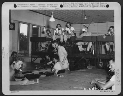 Consolidated > Radar filter room of the 51st Fighter Control Center, Clark Field, Luzon, Philippine Islands. The equipment installed in February 1945 as semi-permanent is AN/TTQ.