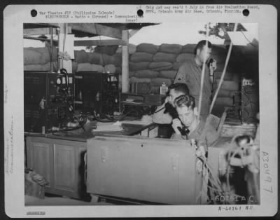 Consolidated > Radio room of the 507th AAA Command Post, Manila, Philippine Islands. Radio's are used during combat to maintain communications with higher headquarters in the event that wire installations are knocked out.