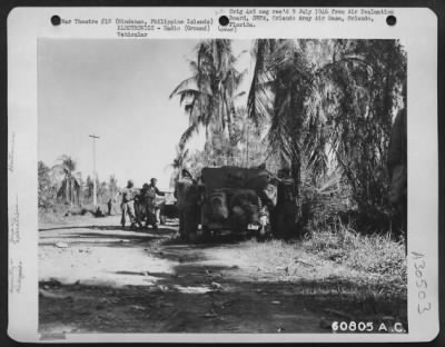 Thumbnail for Consolidated > A JASCO forward control jeep with its radio equipment had just arrived at this scene and is trying to contact a flight of planes directed from the 25th Support Air Party at Division Headquarters. The regimental Commanding Officer had called for air