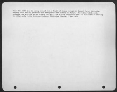 Consolidated > While the JASCO jeep is making contact with a flight of planes through Air Support Party, the mortar company radio control personnel made arrangements for marking the target. The walkie-talkie radio connects them with the mortar company that will