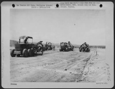 Thumbnail for Consolidated > During reconstruction of Lahug Airstrip, a bulldozer pulls carry-all and a grader levels the surface. Cebu, Philippine Islands, May 1945.