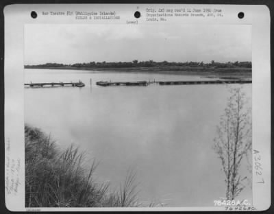 Consolidated > Naguilian bridge over Gagayan River somewhere in the Philippine Islands being reconstructed by "B" Co., 1876th Eng. Aviation Battalion, 6 August 1945.