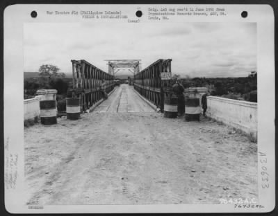 Thumbnail for Consolidated > View of bridge somewhere in the Philippine Islands after reconstruction by "A" Co., 1876th Eng. Aviation Battalion, 5 July 1945.