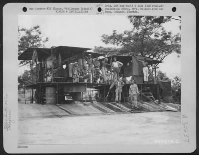 Thumbnail for Consolidated > Hospital linens are washed by Negro troops operating the portable laundry units at Clark Field, Luzon, Philippine Islands. 27 June 1945.