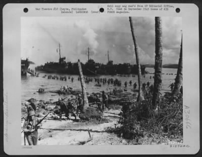 Thumbnail for Consolidated > This photo was taken during landing operations on Tolosa, Leyte, Philippine Islands. Landing parties were equipped with invasion maps and infantry units proceeded inland along routes previously plotted on maps.