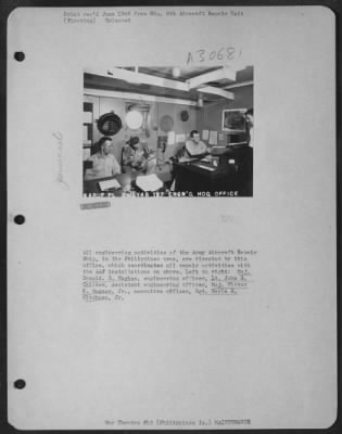 Thumbnail for Consolidated > All engineering activities of the Army Aircraft Repair Ship, in the Philippines area, are directed by this office, which coordinates all repair activities with the AAF installations on shore. Left to right: Maj. Donald E. Hughes, engineering officer