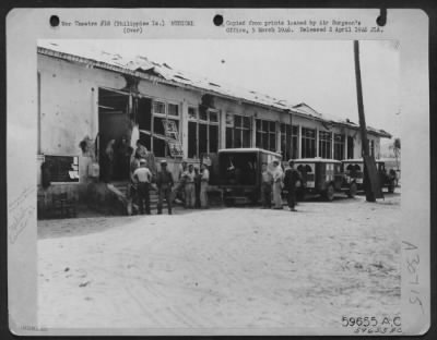 Thumbnail for Consolidated > An ambulance waits to take a patient from the holding station to an airplane for evacuation. Luzon, Philippine Islands.