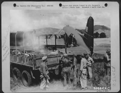 Thumbnail for Consolidated > Mindanao, Philippine Islands, 8 May 1945. Troops of the 124th Infantry Regiment being evacuated from Valencia Airstrip. Troop carrier planes after completing the last trip of their shuttle runs, picked up any wounded personnel to be evacuated and