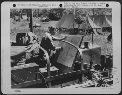 Thumbnail for Consolidated > An Air Support Party Officer preparing his maps for the coming operation on Parang. On this operation the close air support was carried out in a slightly different manner than in the past. Each division in the Corps had an Air Support Party attached