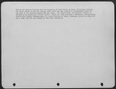 Thumbnail for Consolidated > During the intense fighting for the recapture of Clark Field on Luzon, Philippine Islands, the nerve center of the air liaison plane radio net was located in an abandoned shack, at the edge of the hastily constructed cub strip. Lt. Donald Moore of