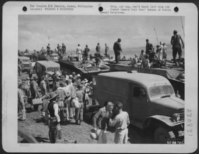 Thumbnail for Consolidated > Internees wounded in the taking of a Prison Camp at Manila, Luzon, Philippine Islands, await evacuation.