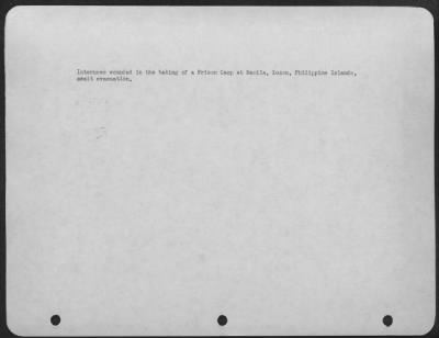 Consolidated > Internees wounded in the taking of a Prison Camp at Manila, Luzon, Philippine Islands, await evacuation.