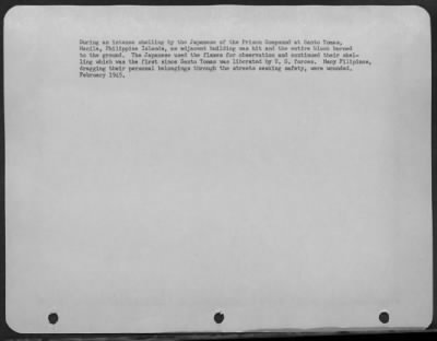 Consolidated > During an intense shelling by the Japanese of the Prison Compound at Santo Tomas, Manila, Philippine Islands, an adjacent building was hit and the entire block burned to the ground. The Japanese used the flames for observation and continued their