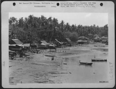 Consolidated > Native huts along coast at Palawan, Philippine Islands. 9 October 1945.