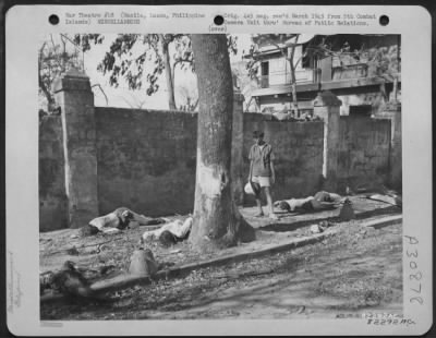 Thumbnail for Consolidated > Another example of Jap brutality is shown in these machine gunned civilians who were mowed down next to this stone wall in the Ermita section of Manila, Luzon, Philippine Islands. Civilians were rounded up in the basement of a nearby building under