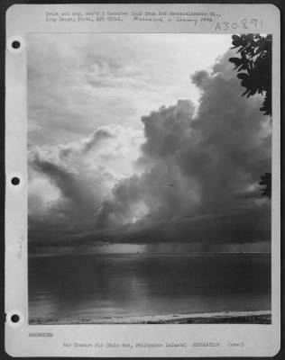 Consolidated > G.I.'s sailing in the Sulu Sea during a rainstorm, Philippine Islands. 21 October 1945.