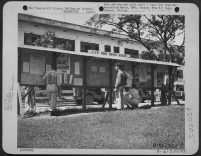 Thumbnail for Consolidated > I and E War News Board of the 11th Special Services. This bulletin board keeps each soldier informed of current events that occur daily. Clark Field, Luzon, Philippine Islands. 1 June 1945.