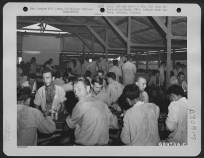 Thumbnail for Consolidated > Ambulatory patients of the 23rd Field Hospital have chow in the enlisted men's mess hall, San Fernando, Cebu, Philippine Islands. 12 August 1945.