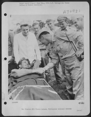 Thumbnail for Consolidated > BACK HOME AGAIN-Brig. General Robert C. Oliver, Chief of Staff of the 13th Air Force, welcomes Lt. Stanley J. Hillock, injured pilot of an Army Air Force Vultee L-5 liaison aircraft which crashed near the Uniray River in the San Angelo Mountains