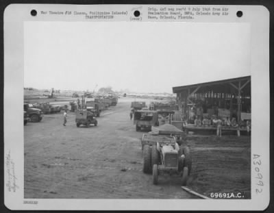 Thumbnail for Consolidated > Equipment, destined for Japan, is loaded on tracks at the Air Transport Command checking area on Nichols Field, Luzon, Philippine Islands. 19 August 1945.