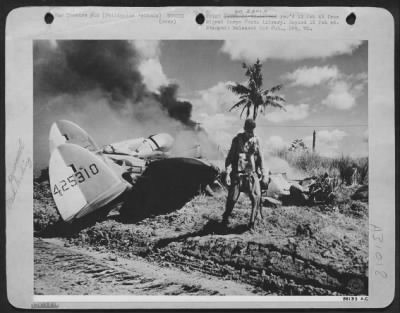 Thumbnail for Consolidated > MIRACULOUS ESCAPE--A dramatic picture of Lt. S.F. Ford, fighter-pilot from Baltimore, Maryland, walking from his Lockheed P-38 Lightning unharmed a few seconds after he crash landed. He was shot down in flames by a Jap Zero over Mindoro Island