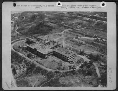 Consolidated > Bomb damage to buildings at Corregidor, Philippine Islands.