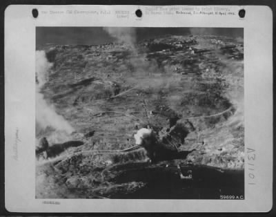 Consolidated > Bombing of Corregidor, Philippine Island while paratroopers land in the background, February 1945.