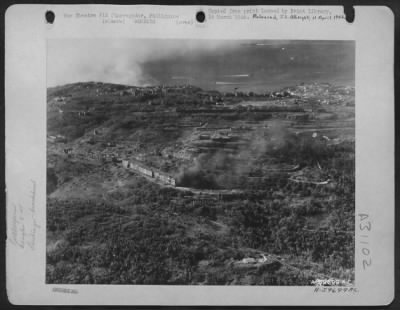 Thumbnail for Consolidated > Bombing of Corregidor, Philippine Islands. Part of the invasion fleet and paratroopers landing can be seen in the background. February 1945.