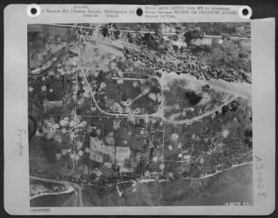 Thumbnail for Consolidated > Bacalod airdrome, a powerful Japanese airbase on Negros Island in the Central Philippines, used by the enemy to stage air power against American forces on Leyte, takes a concentrated dose of direct hits from "Bomber Baron" Liberators of Maj. Gen. St.