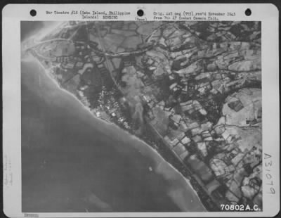 Consolidated > Bombs burst on the target near the city of Naga on Cebu Island in the Philippines. The Guerilla forces operating on Cebu had driven the Japanese into positions about the cities of Naga and Cebu with the exception of the northern tip. Twenty-five