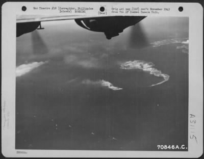 Thumbnail for Consolidated > Between Naval shellings, Consolidated B-24s of the 494th Bomb Group, dropped their bombs on Corregidor and Caballo Island in the Philippines, 14 February 1945. Here, smoke rises from the target.