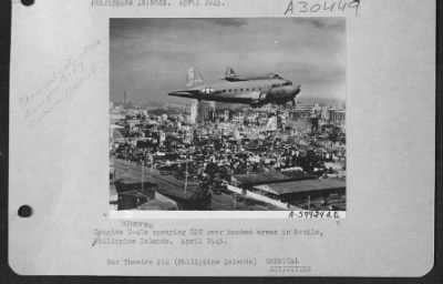 Thumbnail for Consolidated > Douglas C-47S Spraying Ddt Over Bombed Areas In Manila, Philippine Islands.  April 1945.