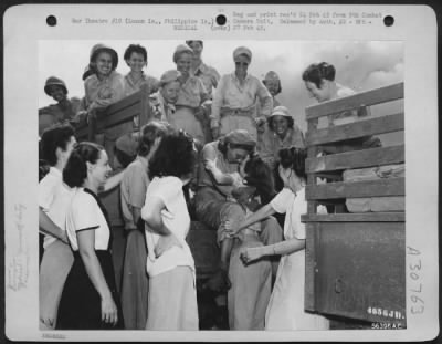 Thumbnail for Consolidated > Manila, Philippine - The Army Nurses, Who Are Veterans Of Bataan And Corregidor And Who Have Been Imprisoned At Santo Tomas For The Past Three Years, Give The Newly Arrived Nurses A Hysterical Welcome. Many Of Them Are Old Friends.Picture Shows Interned N